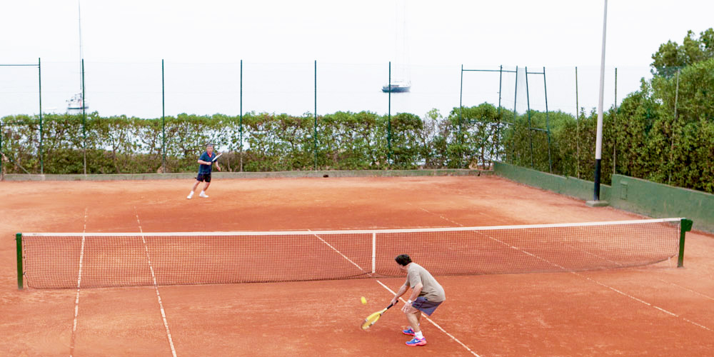 Portals Nous property owners playing tennis.