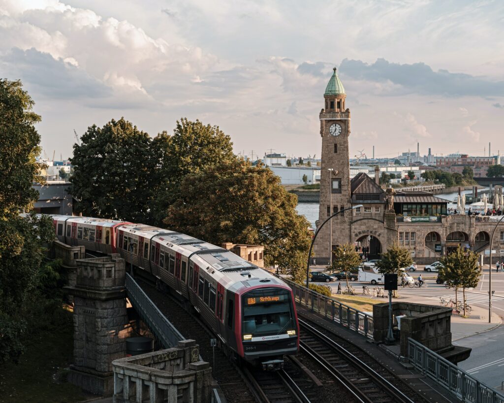 View on Hamburg hochbahn train and Landugsbrücke clock tower from above.
