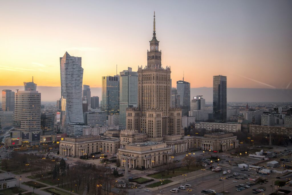 Photo by @aquadrata on Unsplash showing the landscape of business buildings in Warsaw, Poland